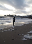 SX21393 Jenni runnig from waves on Tenby beach.jpg